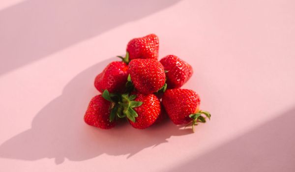 red strawberry in pink background